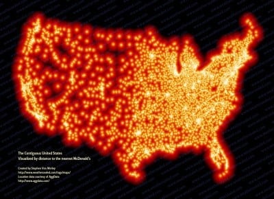 Map of McDonalds restaurant locations in the United States. Map is glowing shades of orange for the locations on a black background.