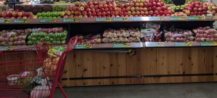 Photo of fruits and vegetables in a store.