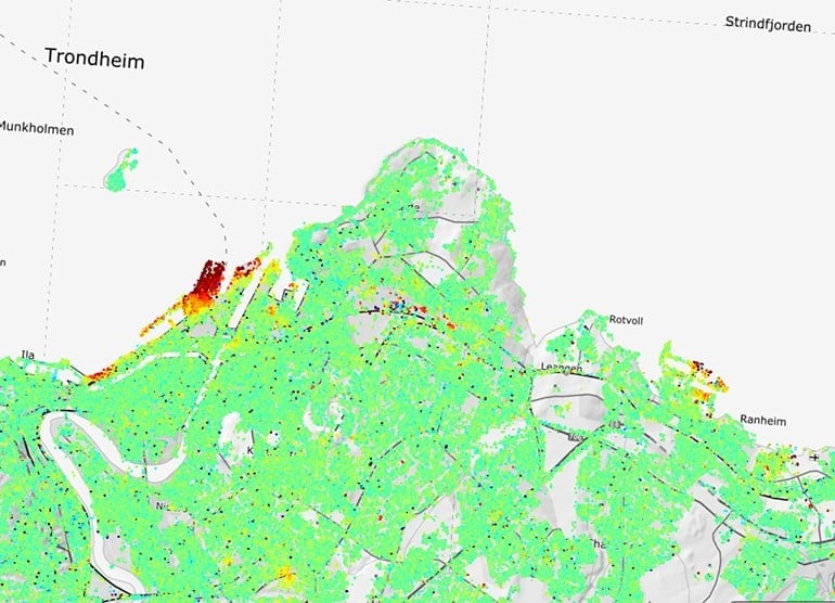 InSAR data for the Trondheim harbor area. Green are areas with no movement, yellow and red points are areas that are moving about 1 cm/year in the residential areas and 2 cm/year along the harbor. Source: Geological Survey of Norway.