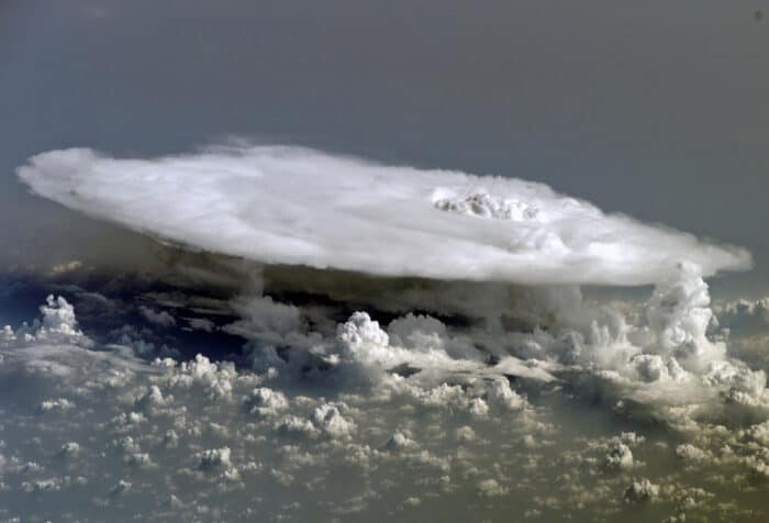 Satellite view of cumulonimbus cloud over Africa. These dramatic cloud formations are caused by rising air currents containing water vapor and varying layers of differing-temperature air in the upper atmosphere. Image: NASA