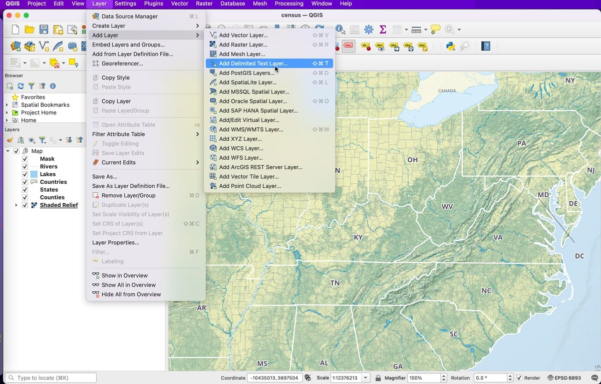A screenshot show where to find the add delimited text file tool in QGIS.