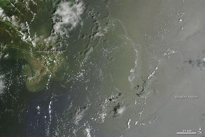 Satellite imagery over the Gulf of Mexico showing oil slicks in the water.