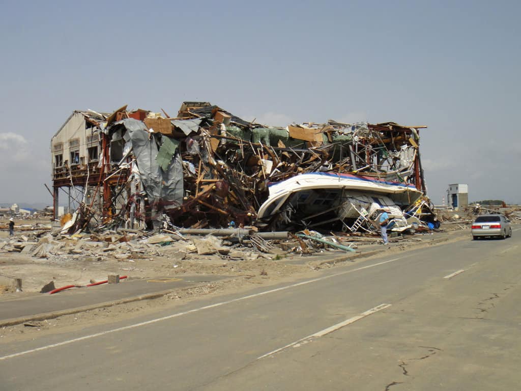 A photo showing a damaged building from a tsunami in Japan.