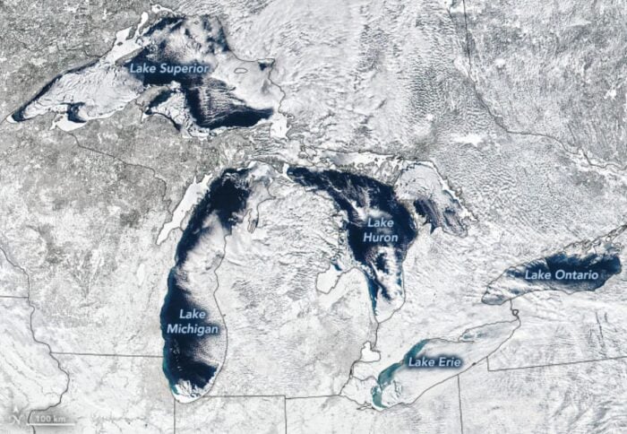 A satellite image taken in February 2021 that shows much of the Great Lakes area covered in ice.