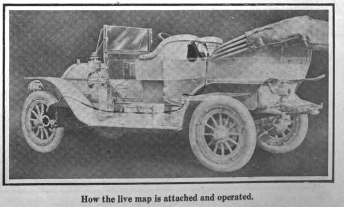 A photograph from 1911 showing how a car navigation device was written to the gears in order to track mileage.