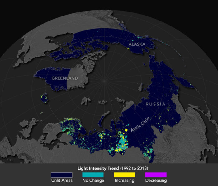 Map showing areas of increased artificial lighting in the Arctic, with increases in yellow, decreases in purple, and no change in green, using data from the U.S. DMSP satellites. Map: NASA, public domain.