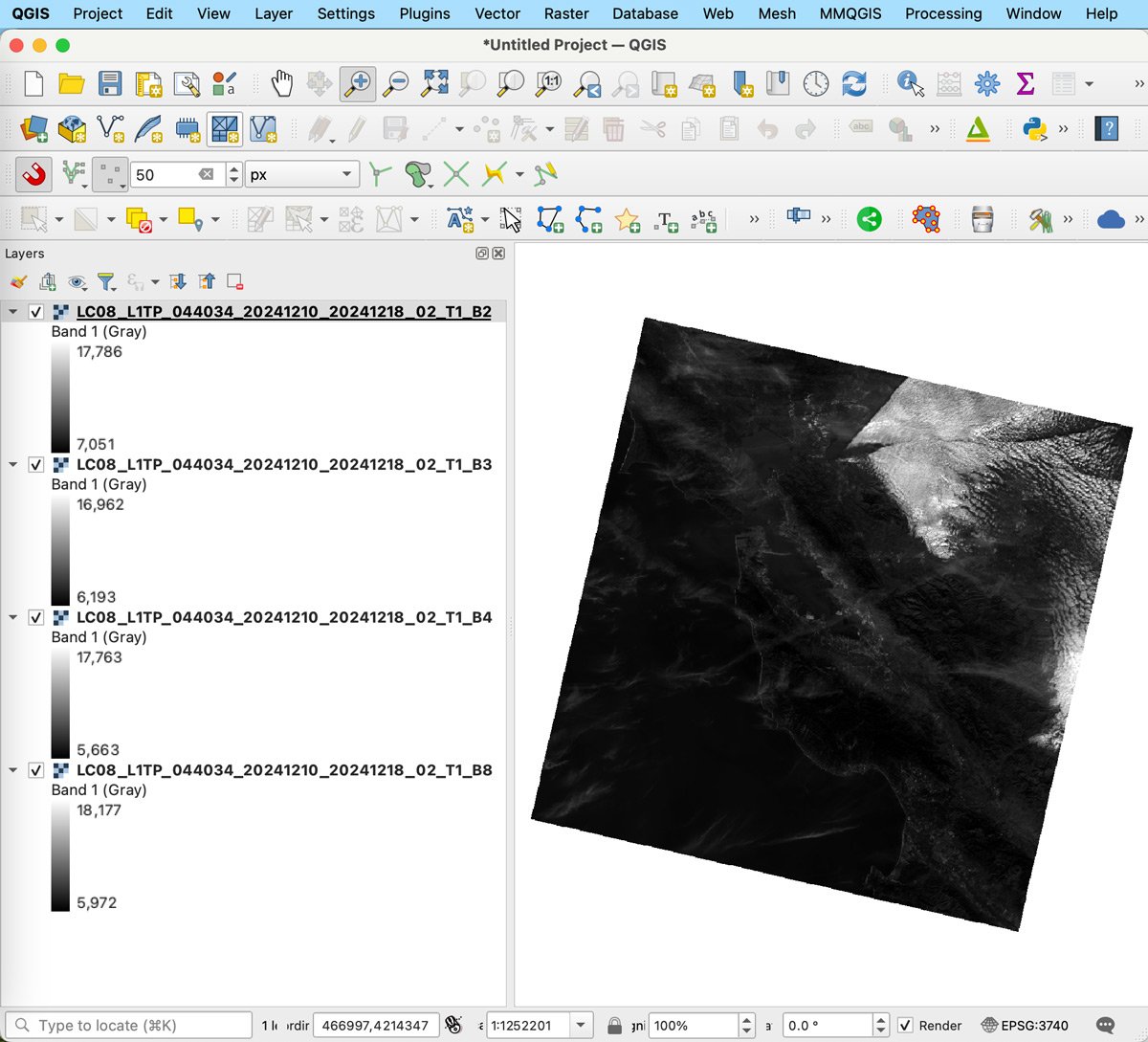 A map view in QGIS showing Landsat Imagery.