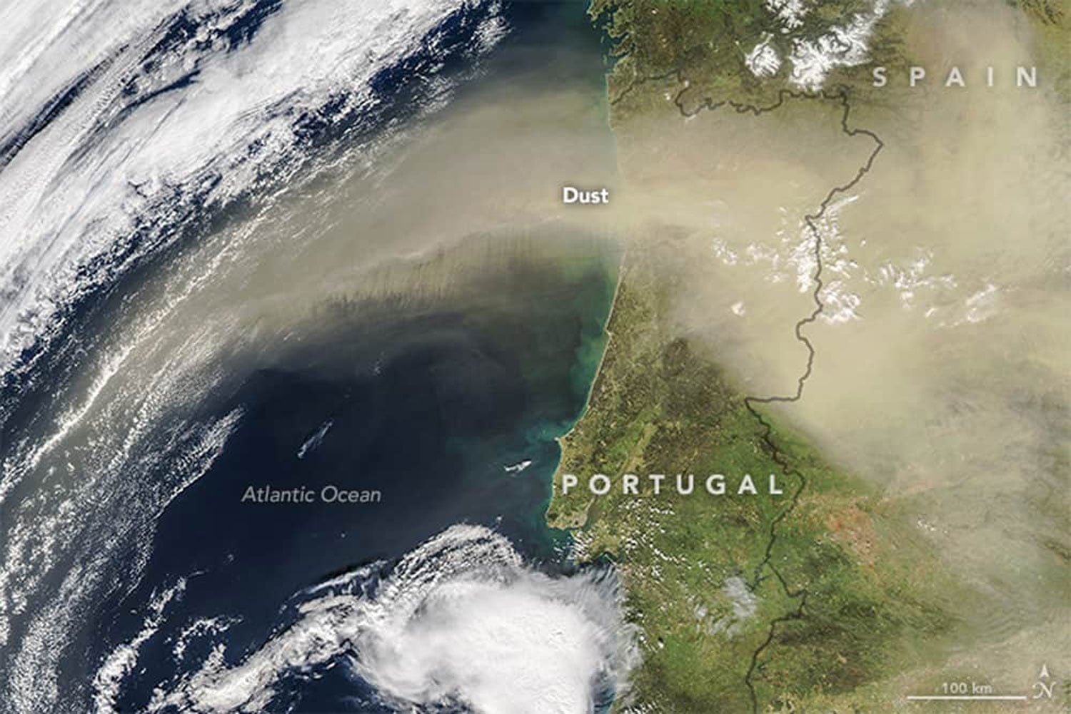 A massive plume of sand and dust was pushed northward from the Sahara desert by the calima, a warm southeasterly wind prevalent in North Africa in the winter, as seen in a satellite view of Spain and Portugal. Image: February 21, 2016, NASA.