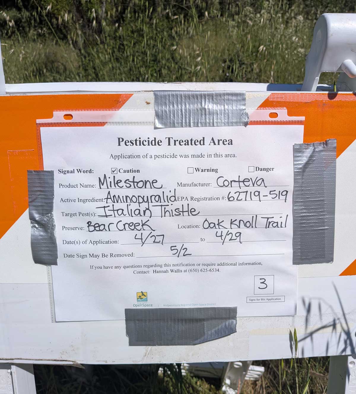 A Midpen sign for pesticide use at an open space preserve.  